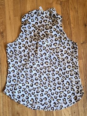 A Diva Leopard Print Sleeveless Halter Satin Top Featuring a Tie Neckline Size L